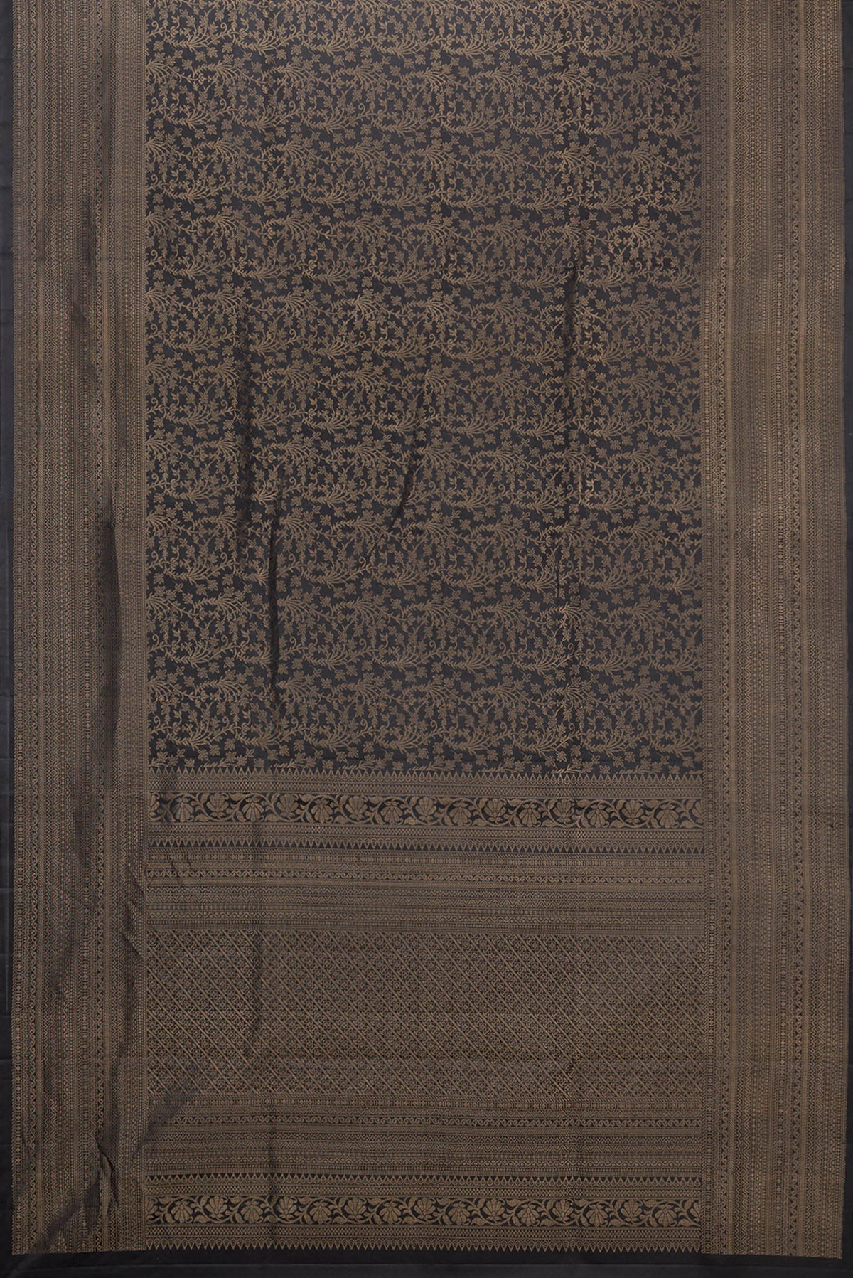 Flat view of Pure Silk Black Soft Saree with Zari Brocade on the body and Zari Border. 
