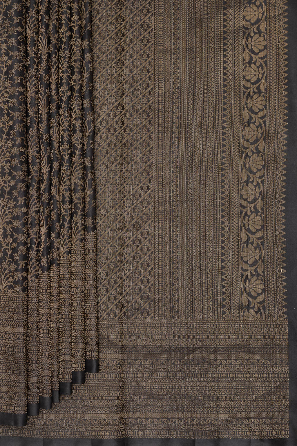 Pleats and pallu of Pure Silk Black Soft Saree with Zari Brocade on the body and Zari Border. 