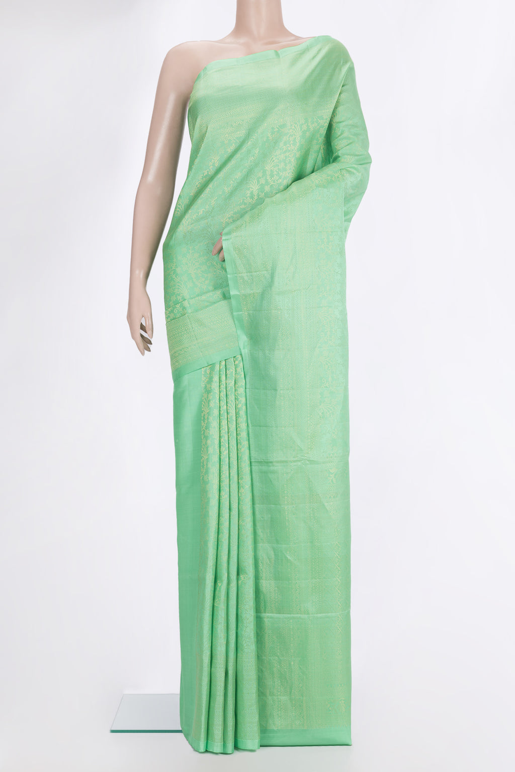 Pure Silk Mint Green Soft Saree with Zari Brocade on the body and Zari Border.  displayed on a mannequin