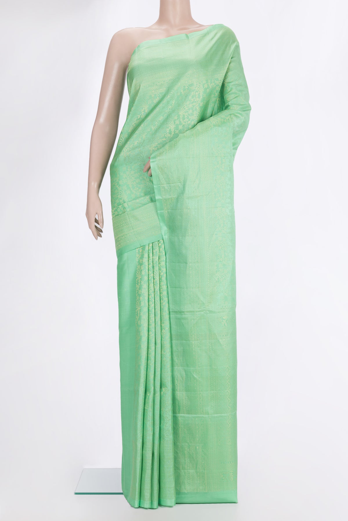 Pure Silk Mint Green Soft Saree with Zari Brocade on the body and Zari Border.  displayed on a mannequin