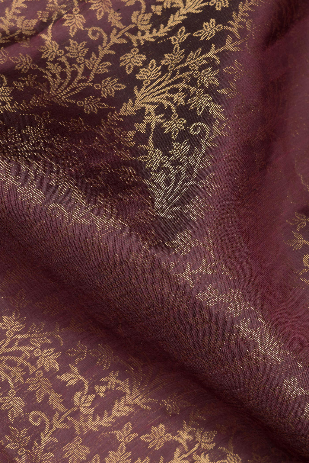 Close up of Pure Silk Coffee Brown Soft Saree with Zari Brocade on the body and Zari Border.  displaying folds