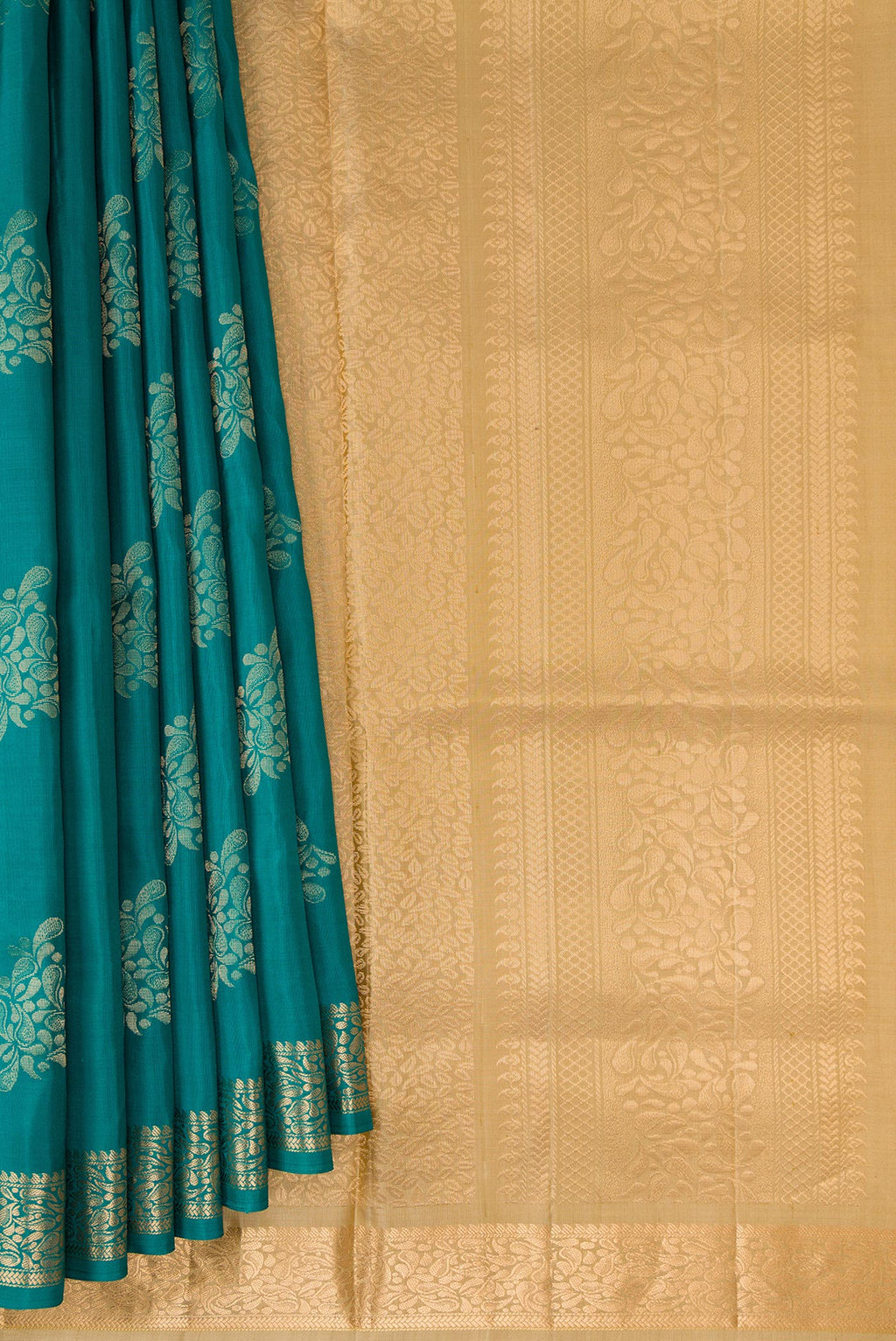 Pleats and pallu of Pure Silk Teal Soft Saree with Zari Butta on the body and Zari Border. 