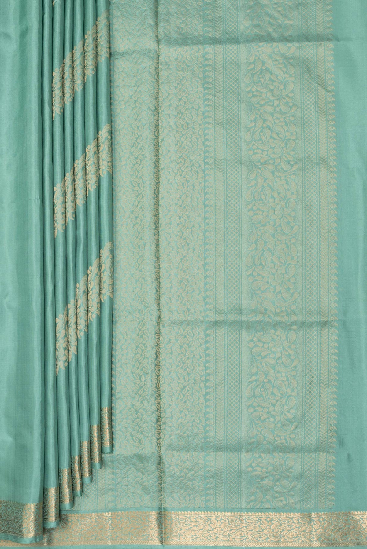 Pleats and pallu of Pure Silk Sea Green Soft Saree with Zari Butta on the body and Zari Border. 