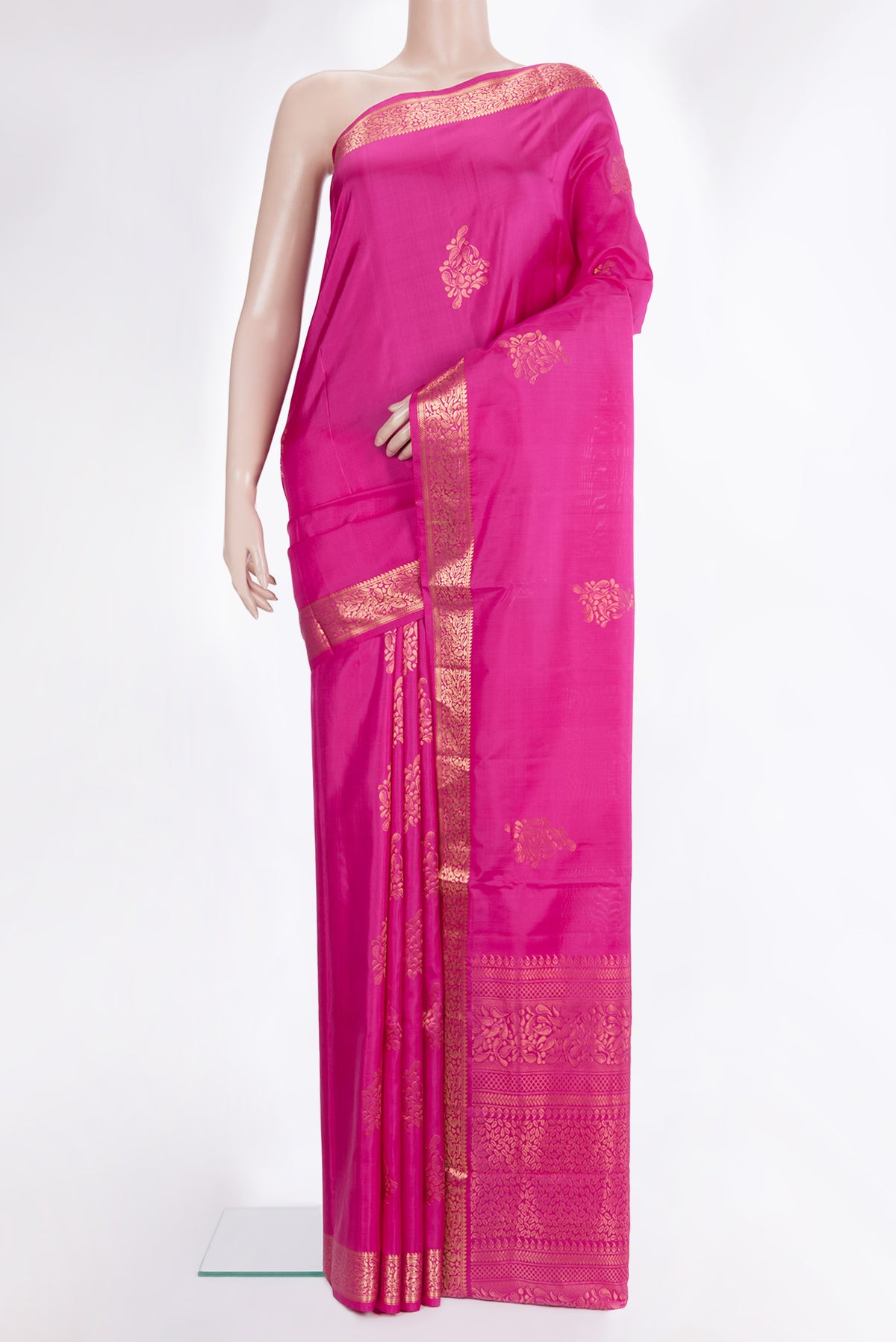 Pure Silk Pink Soft Saree with Zari Butta on the body and Zari Border.  displayed on a mannequin