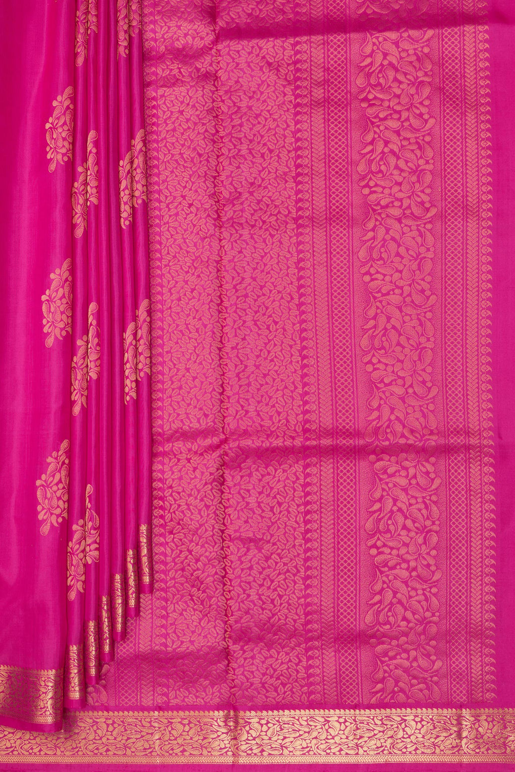 Pleats and pallu of Pure Silk Pink Soft Saree with Zari Butta on the body and Zari Border. 