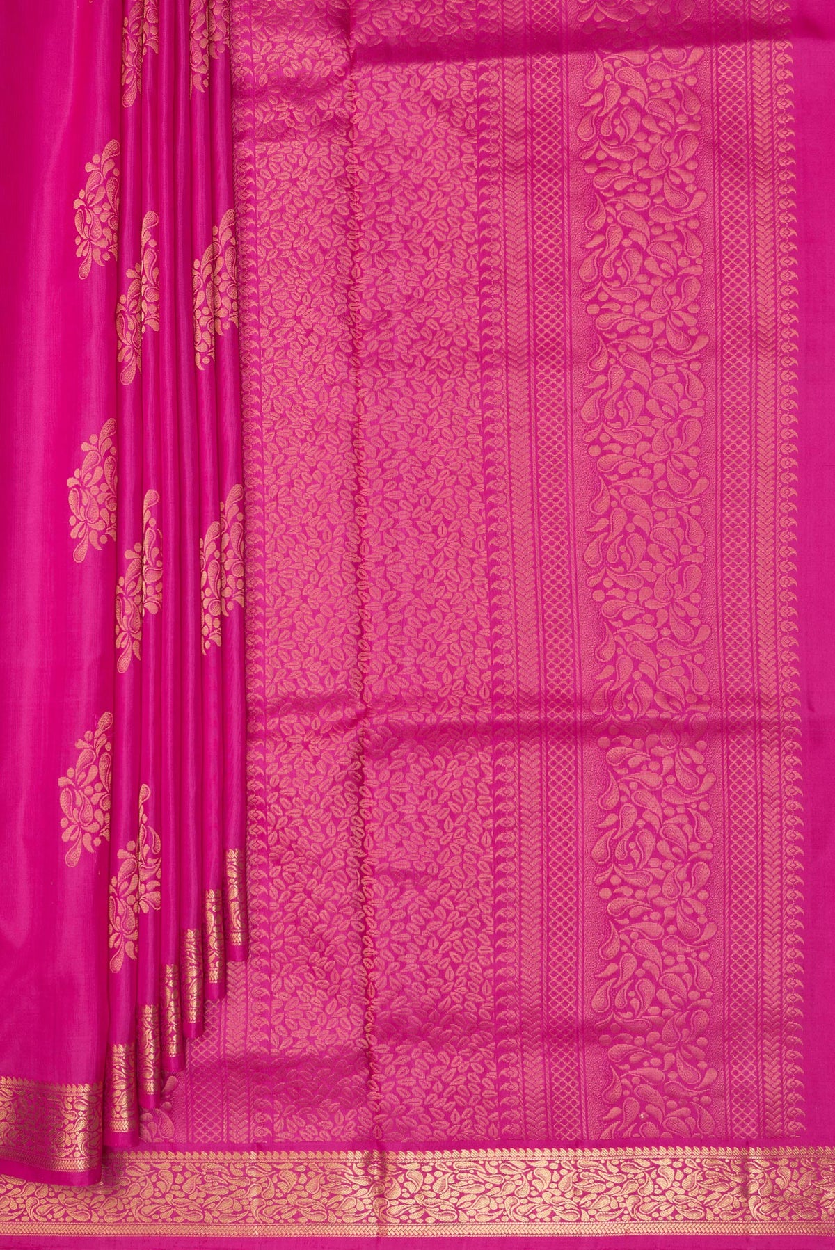 Pleats and pallu of Pure Silk Pink Soft Saree with Zari Butta on the body and Zari Border. 