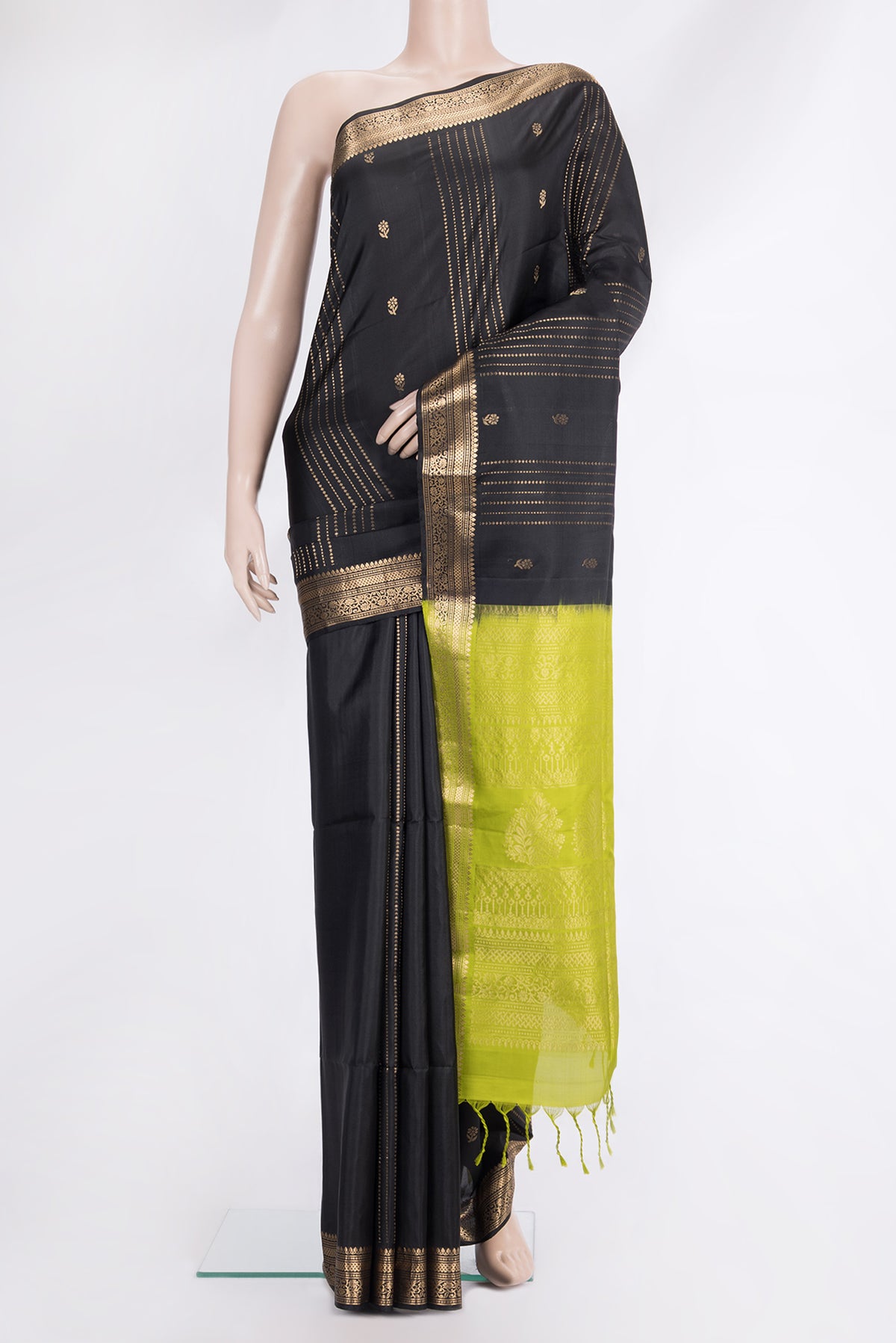 Pure Silk Black Soft Saree with Zari Butta on the body and Zari Border.  displayed on a mannequin