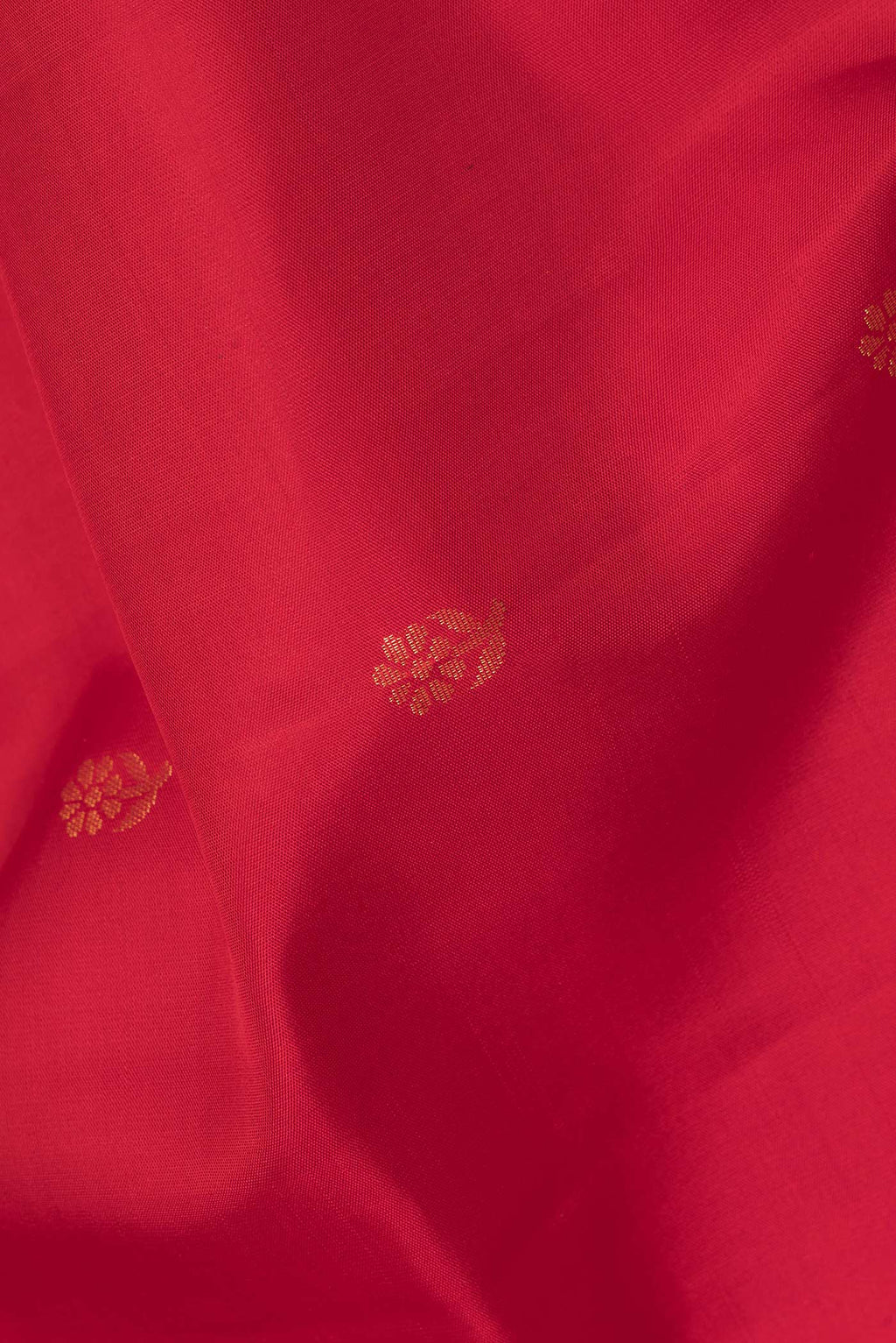 Close up of Pure Silk Red Dual Tone Soft Saree with Zari Butta on the body and Zari Border.  displaying folds