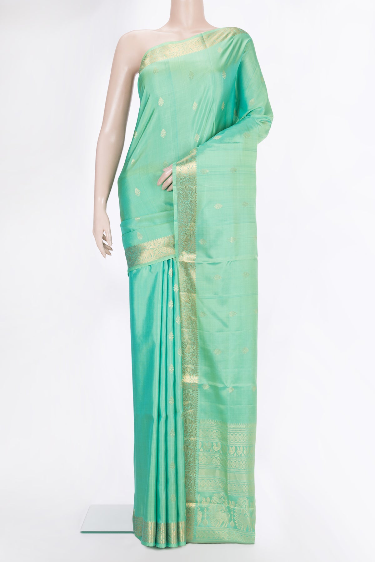 Pure Silk Sea Green Dual Tone Soft Saree with Zari Butta on the body and Zari Border.  displayed on a mannequin