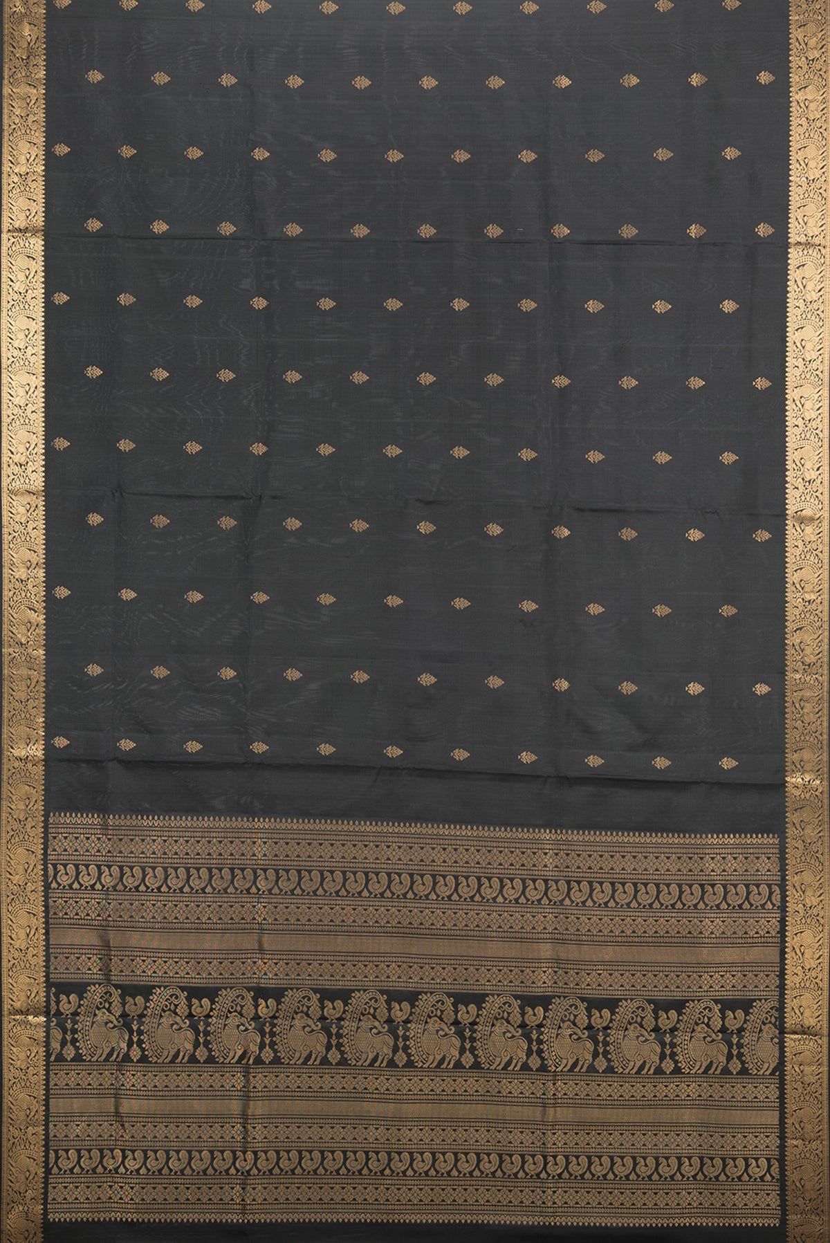 Flat view of Pure Silk Black Soft Saree with Zari Butta on the body and Zari Border. 