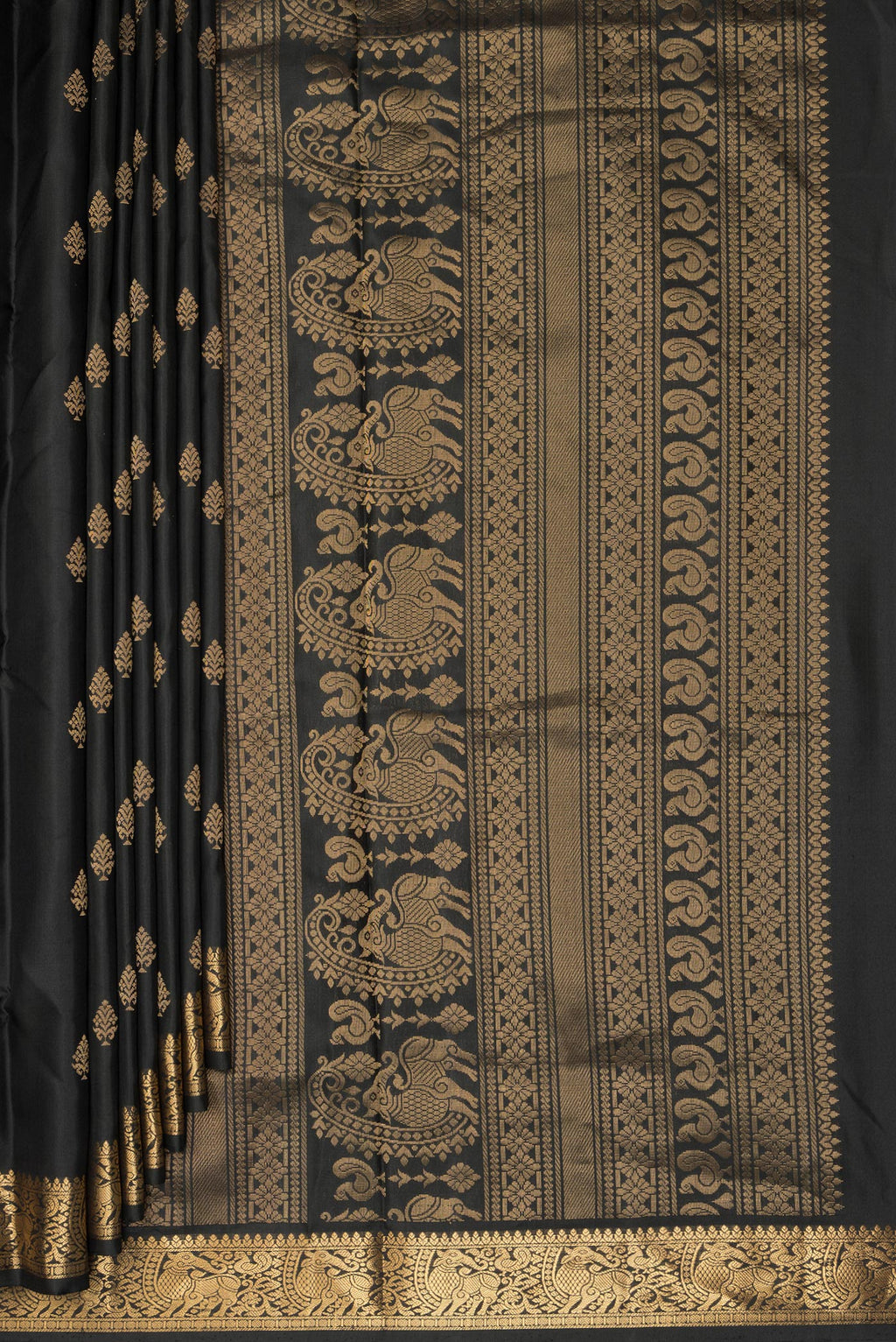 Pleats and pallu of Pure Silk Black Soft Saree with Zari Butta on the body and Zari Border. 
