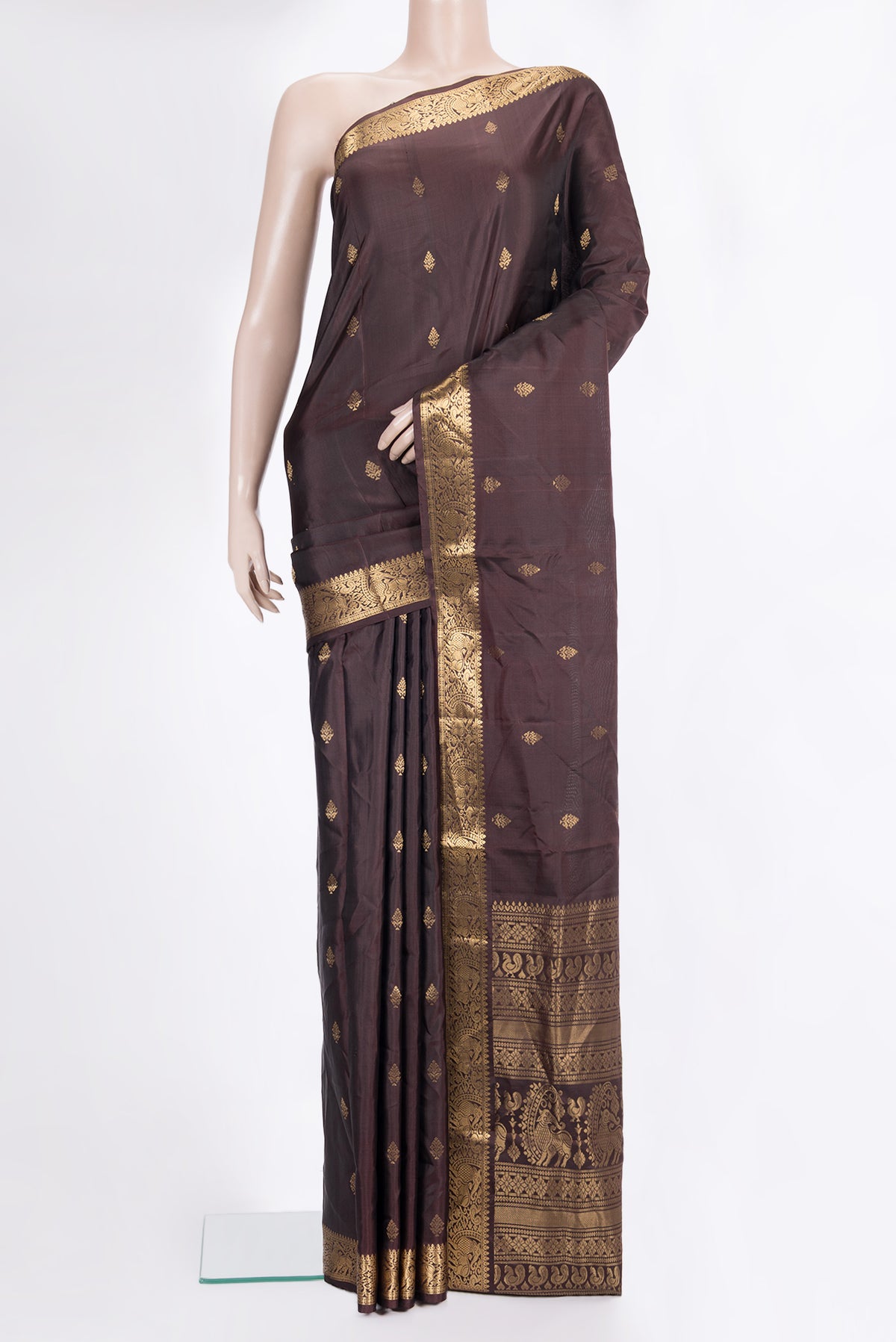 Pure Silk Coffee Brown Soft Saree with Zari Butta on the body and Zari Border.  displayed on a mannequin