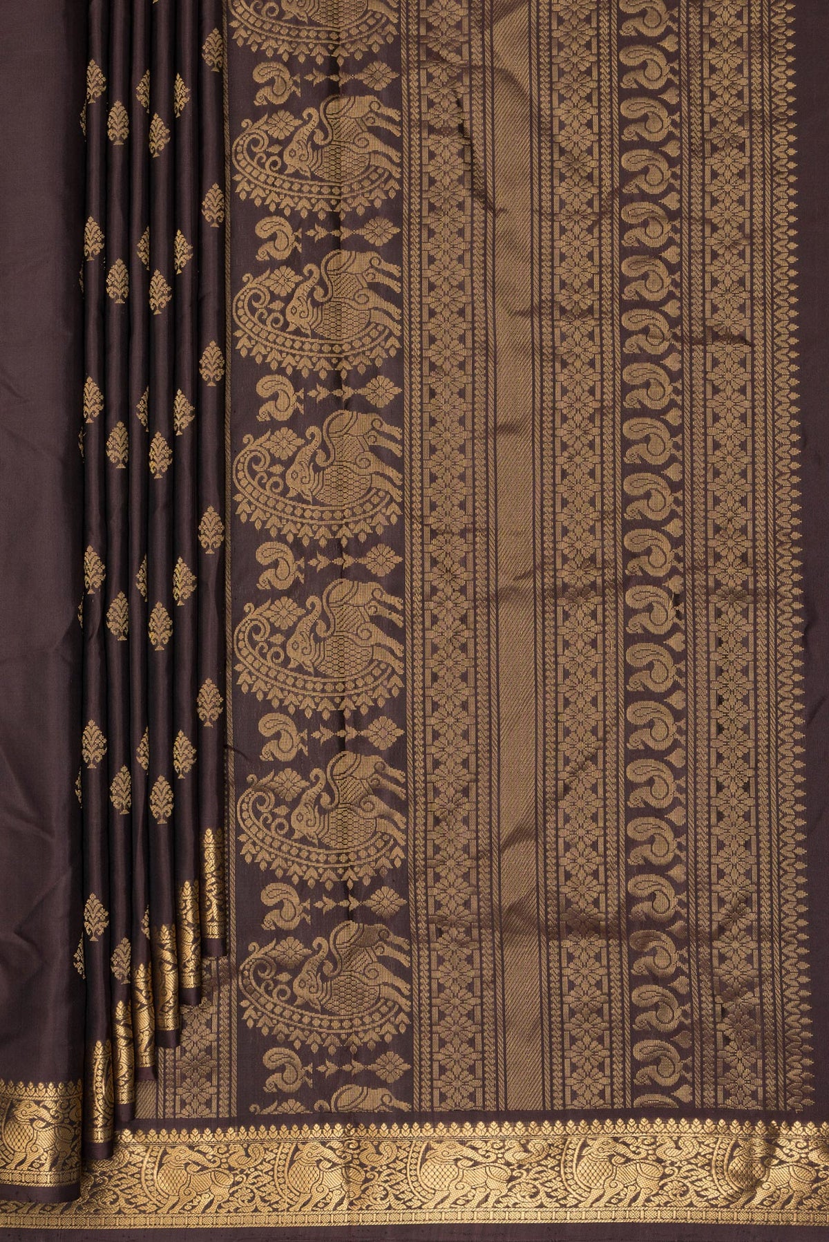 Pleats and pallu of Pure Silk Coffee Brown Soft Saree with Zari Butta on the body and Zari Border. 