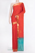 Pure Silk Orange Dual Tone Soft Saree with Zari Butta on the body and Zari Border.  displayed on a mannequin