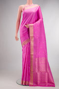 Pure Silk Pink Soft Saree with Zari Butta on the body and Zari Border.  displayed on a mannequin