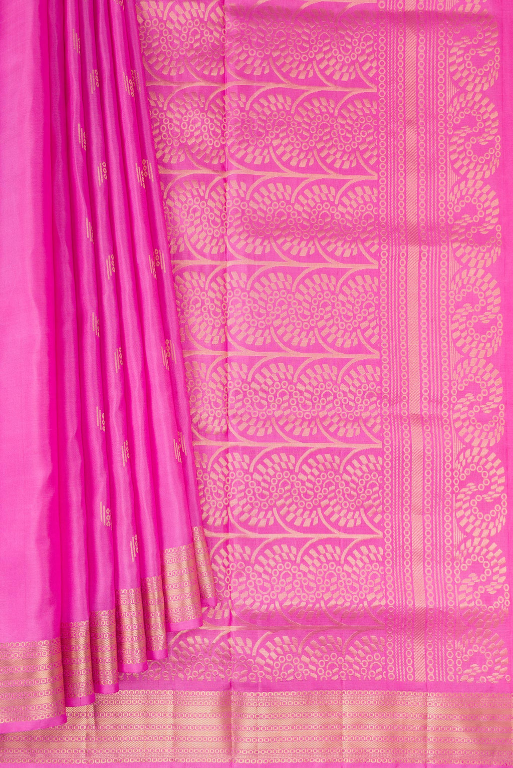 Pleats and pallu of Pure Silk Pink Soft Saree with Zari Butta on the body and Zari Border. 