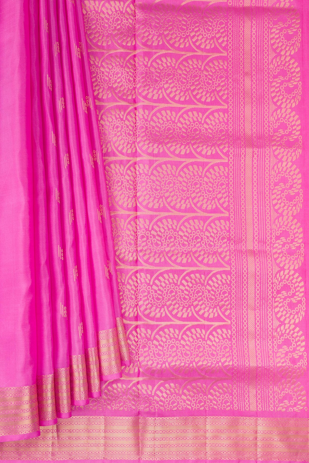 Pleats and pallu of Pure Silk Pink Soft Saree with Zari Butta on the body and Zari Border. 