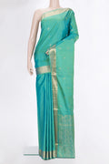 Pure Silk Sea Green Dual Tone Soft Saree with Zari Butta on the body and Zari Border.  displayed on a mannequin