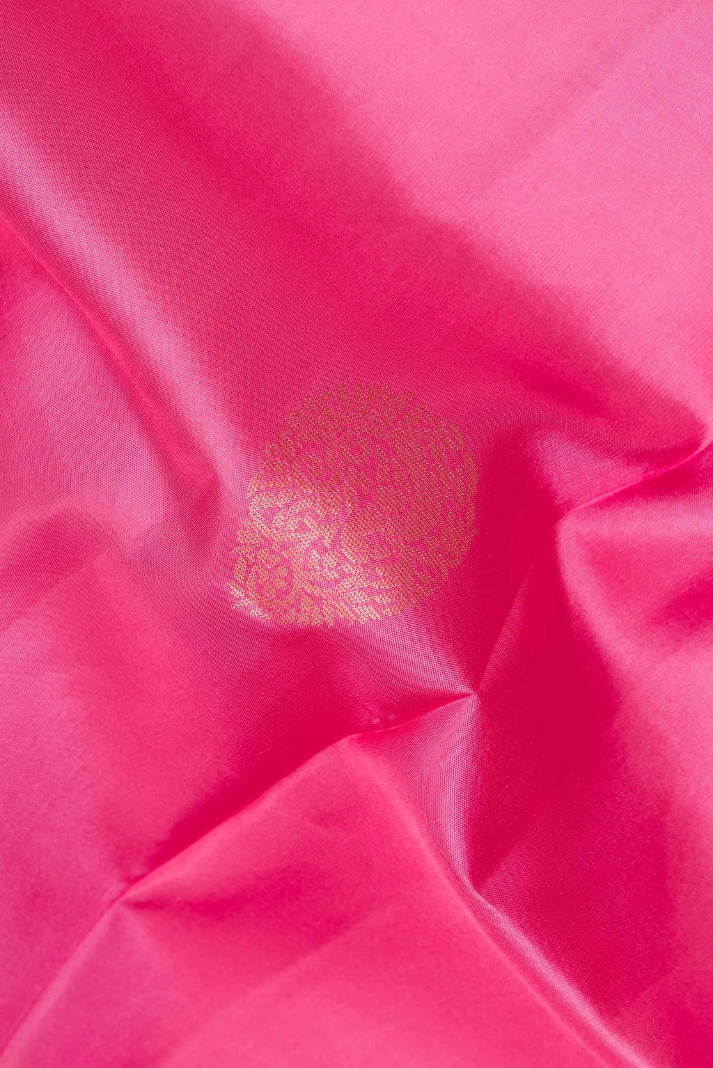 Close up of Pure Silk Pink Dual Tone Soft Saree with Zari Butta on the body and Zari Border.  displaying folds