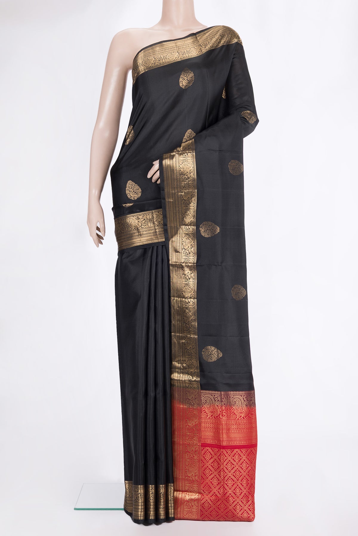 Pure Silk Black Soft Saree with Zari Butta on the body and Zari Border.  displayed on a mannequin