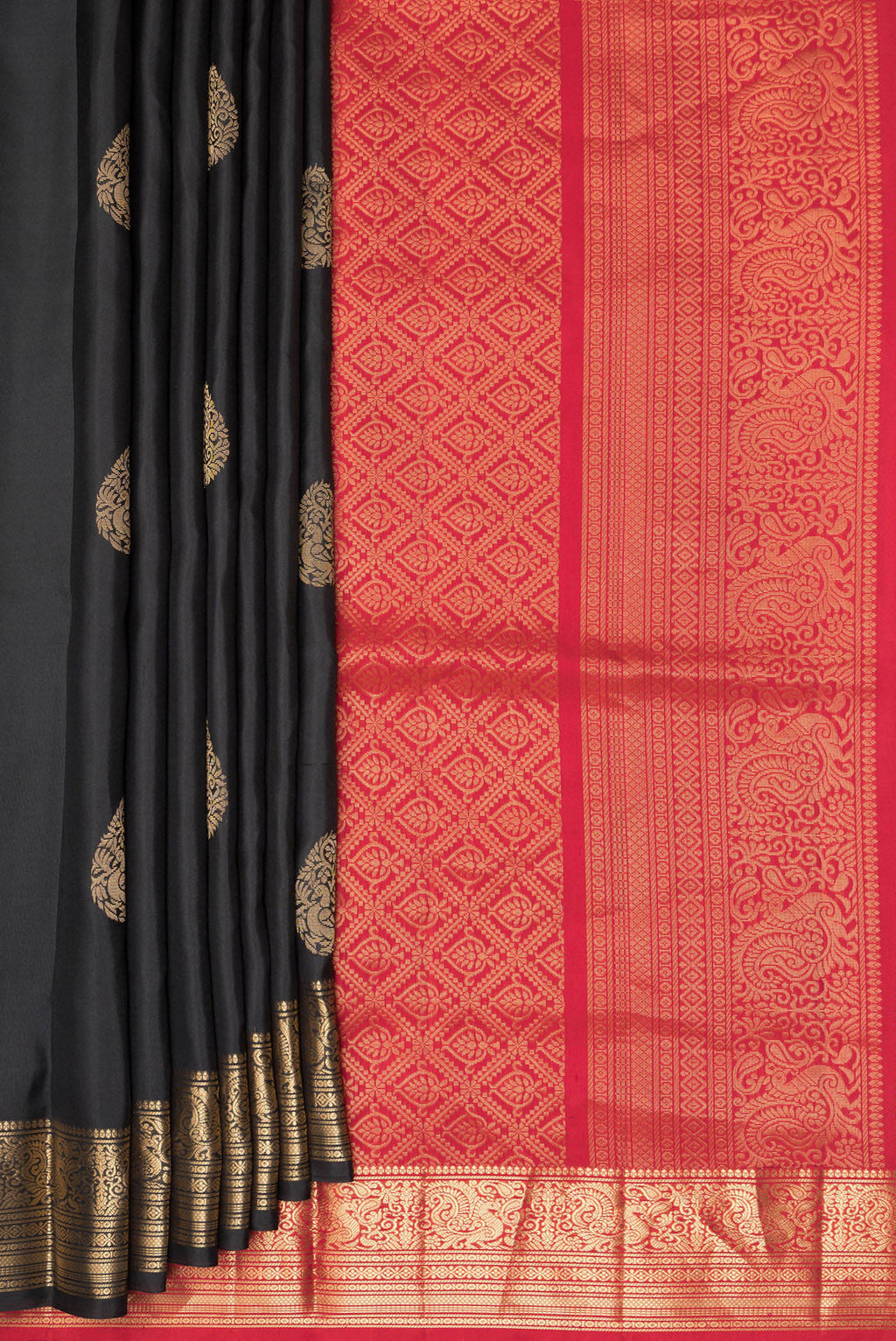 Pleats and pallu of Pure Silk Black Soft Saree with Zari Butta on the body and Zari Border. 