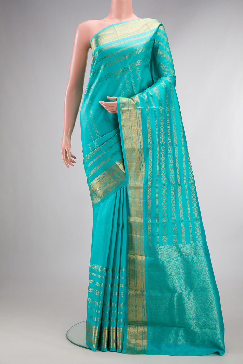 Pure Silk Turquoise Kanchipuram Saree with Stripes on the body and Zari Border.  displayed on a mannequin