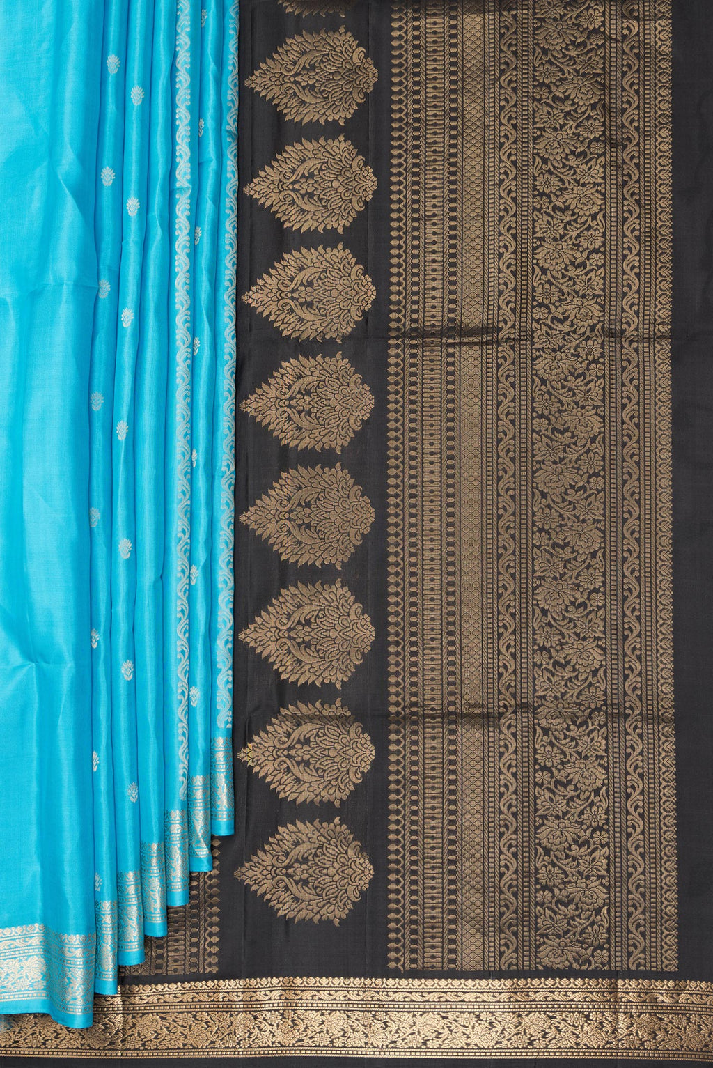 Pleats and pallu of Pure Silk Sky Blue Soft Saree with Zari Butta on the body and Zari Border. 