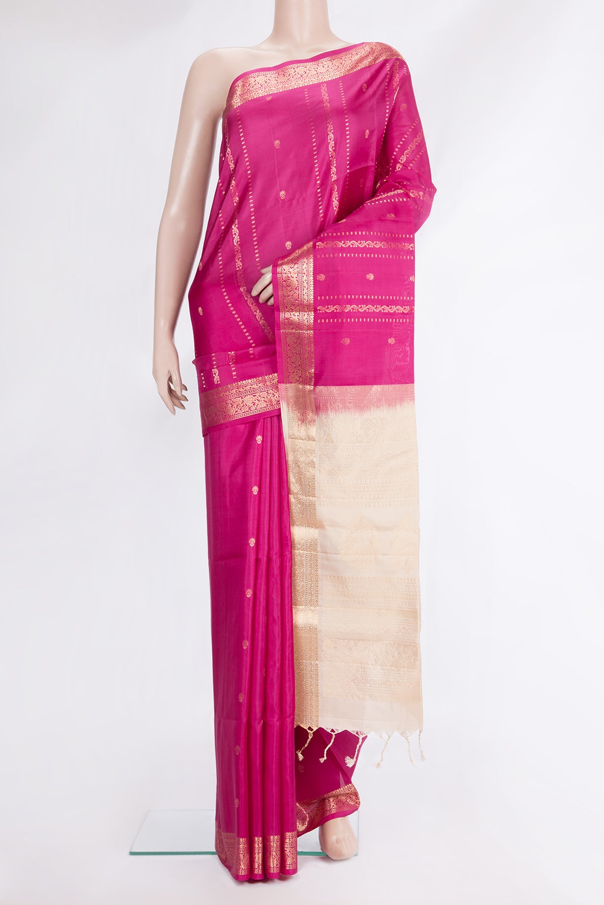 Pure Silk Dark Pink Soft Saree with Zari Butta on the body and Zari Border.  displayed on a mannequin