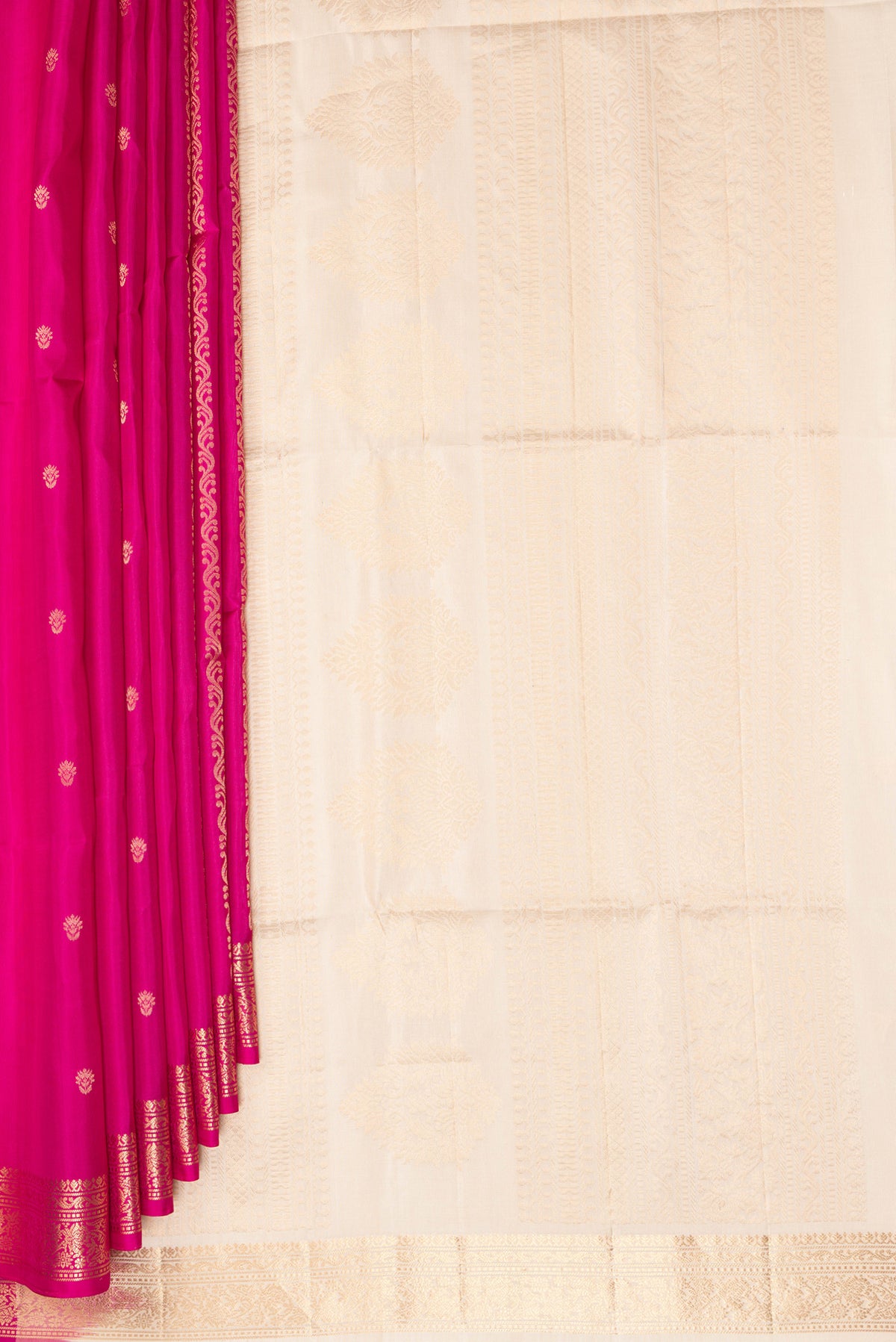 Pleats and pallu of Pure Silk Dark Pink Soft Saree with Zari Butta on the body and Zari Border. 