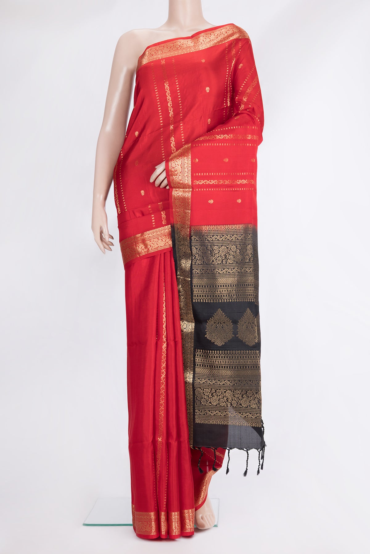Pure Silk Red Soft Saree with Zari Butta on the body and Zari Border.  displayed on a mannequin