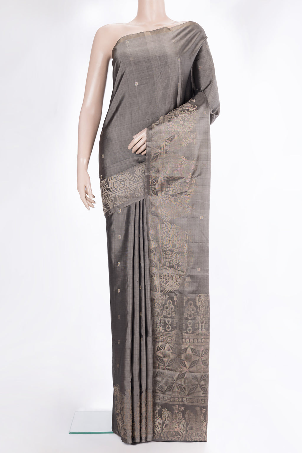 Pure Silk Grey Soft Saree with Zari Butta on the body and Fancy Border.  displayed on a mannequin
