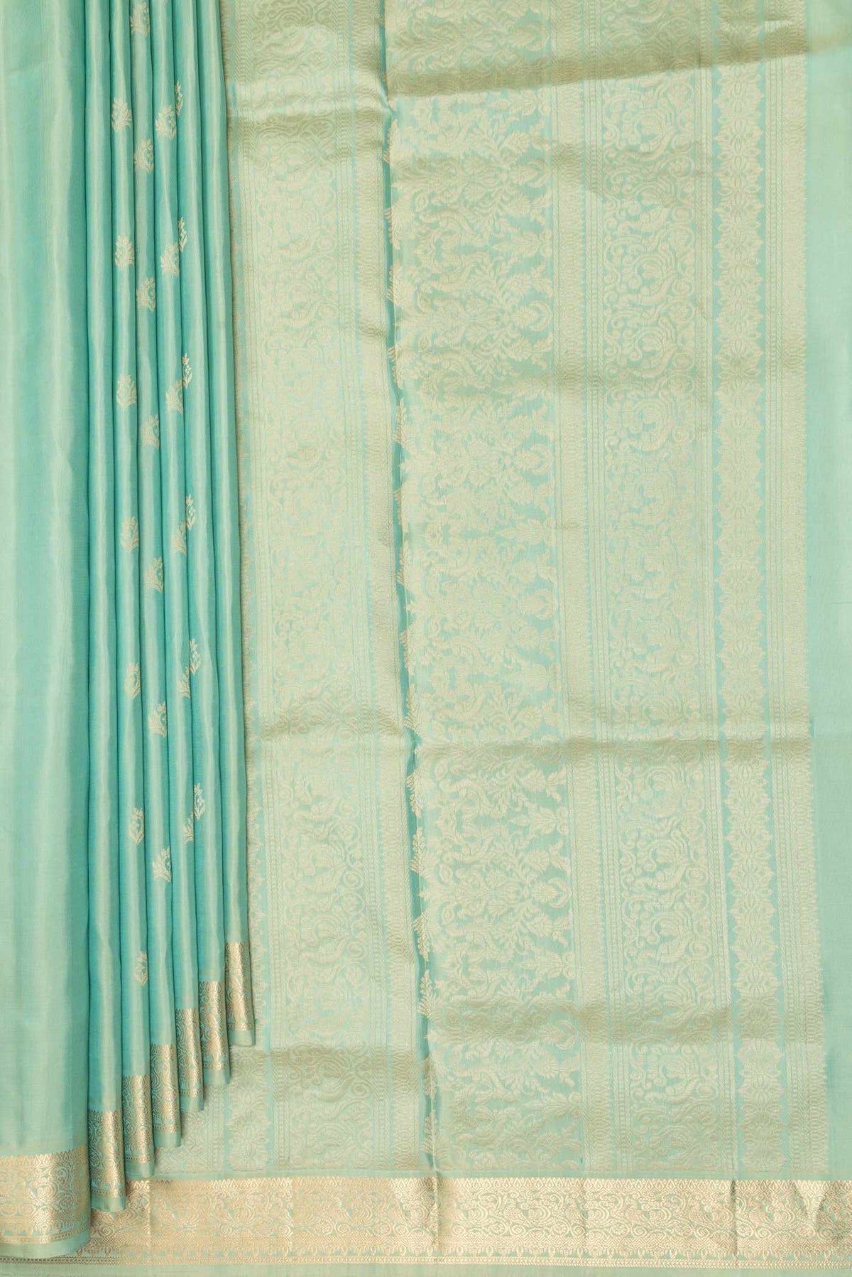 Pleats and pallu of Pure Silk Pista Green Soft Saree with Zari Butta on the body and Zari Border. 