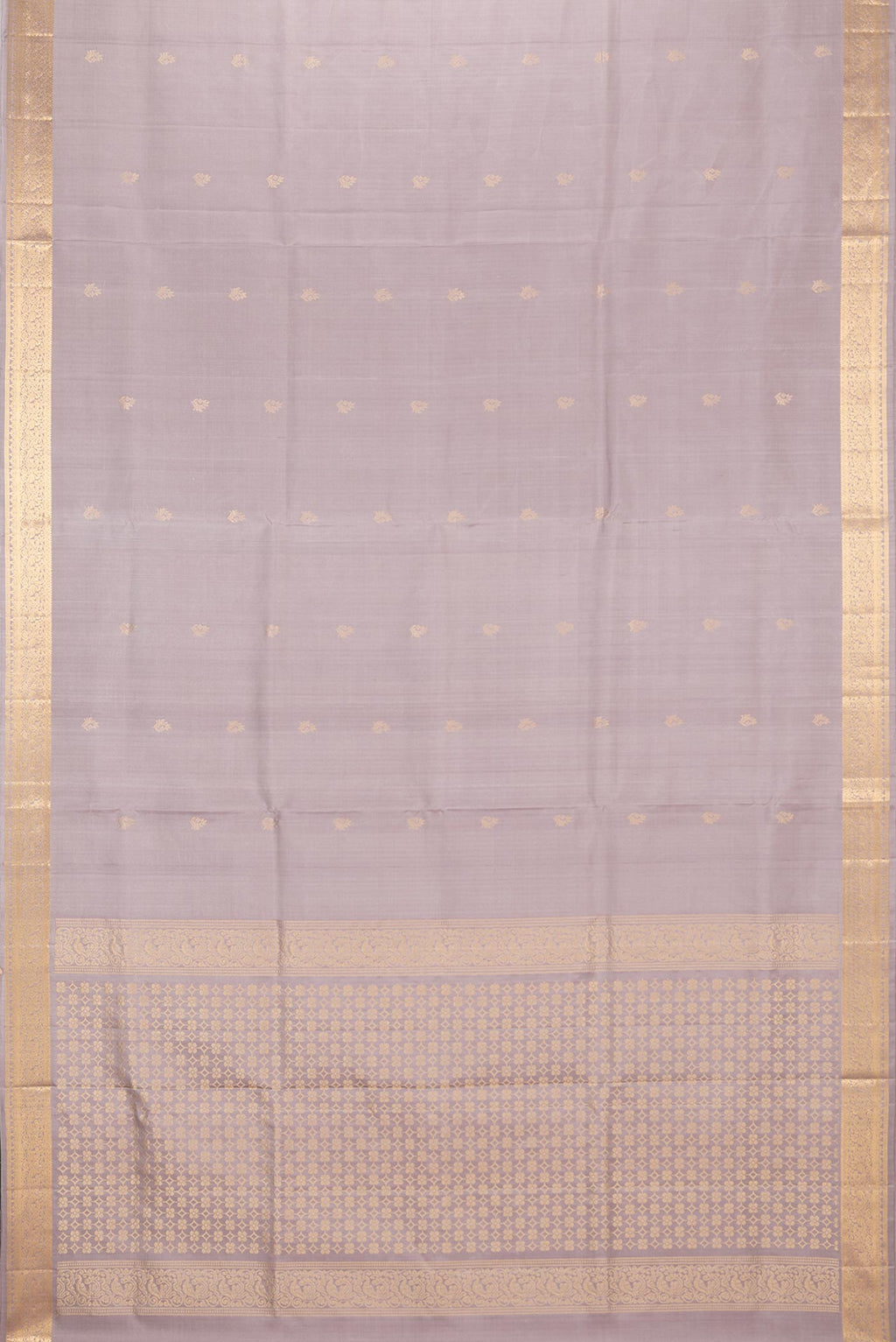 Flat view of Pure Silk Beige Soft Saree with Zari Butta on the body and Zari Border. 