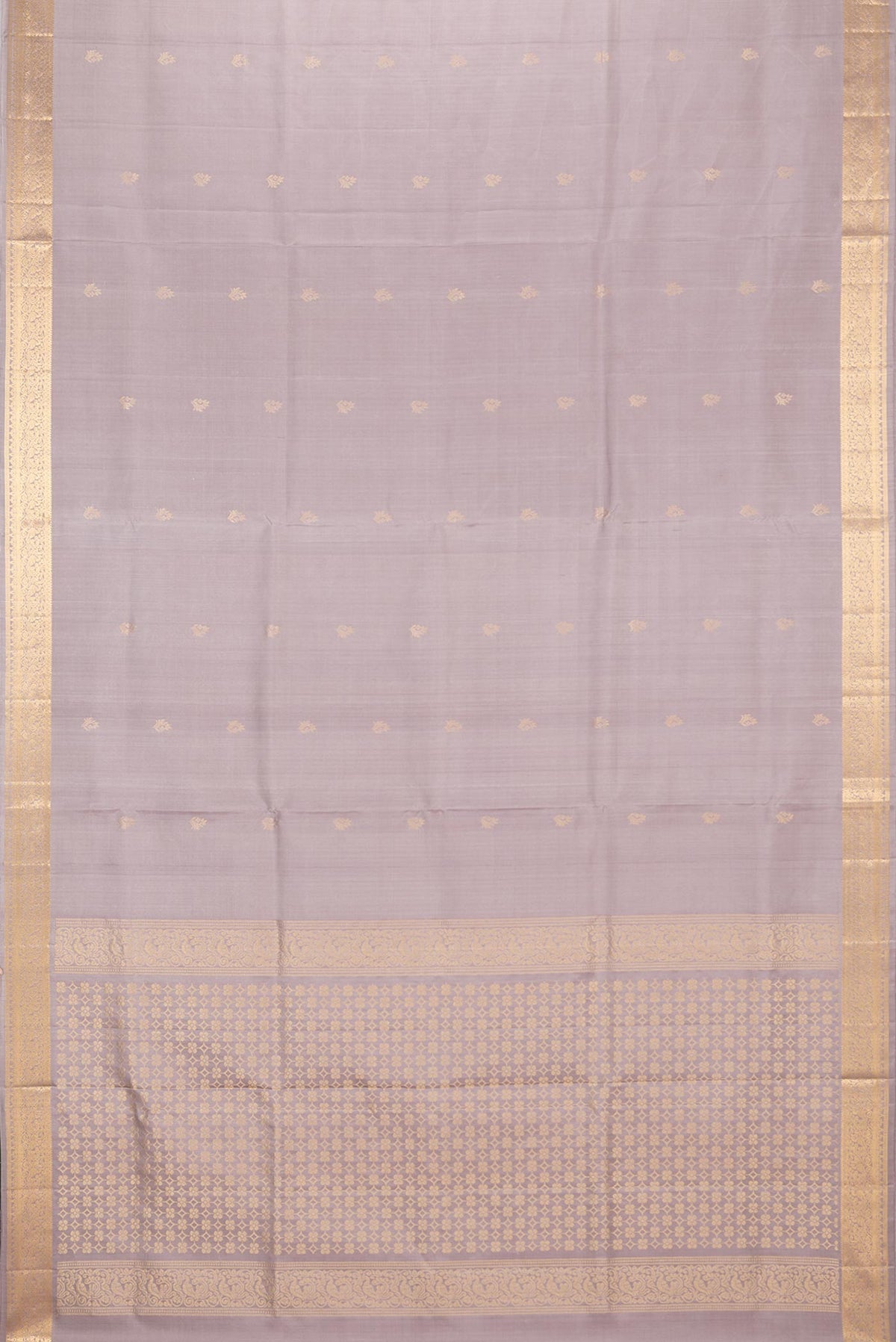 Flat view of Pure Silk Beige Soft Saree with Zari Butta on the body and Zari Border. 