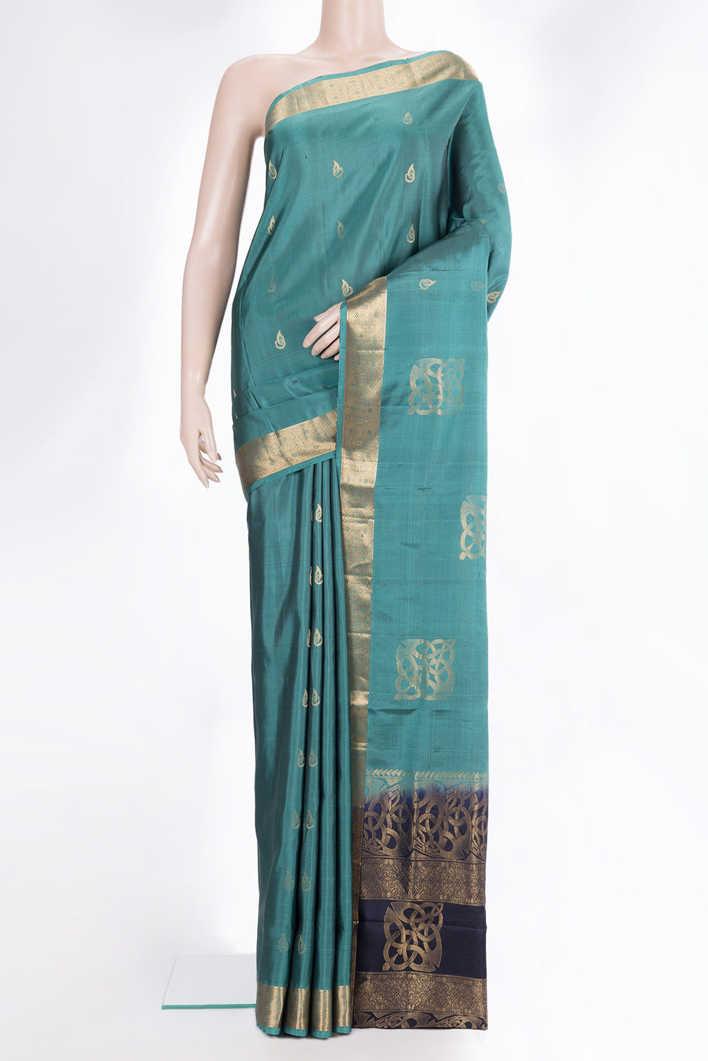 Pure Silk Green Soft Saree with Zari Butta on the body and Zari Border.  displayed on a mannequin