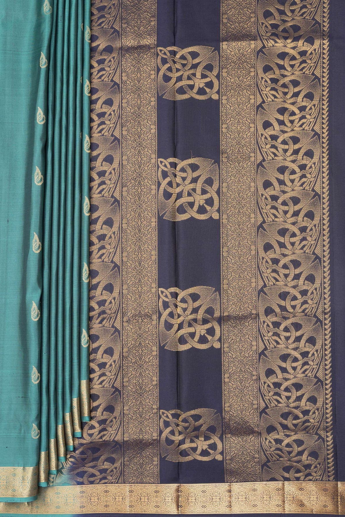 Pleats and pallu of Pure Silk Green Soft Saree with Zari Butta on the body and Zari Border. 
