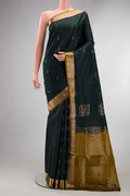 Pure Silk Bottle Green Soft Saree with Zari Butta on the body and Zari Border.  displayed on a mannequin