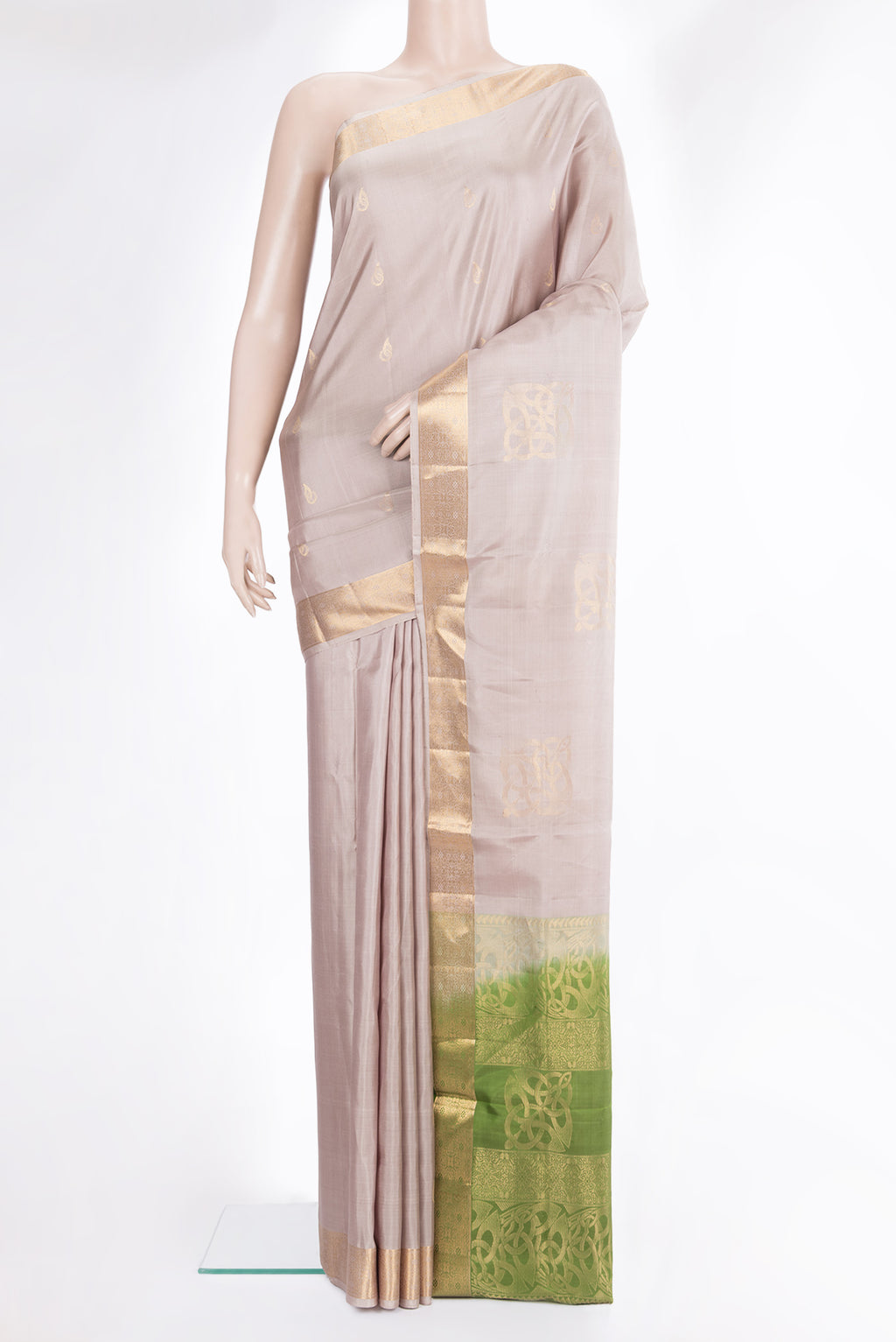 Pure Silk Beige Soft Saree with Zari Butta on the body and Zari Border.  displayed on a mannequin