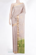 Pure Silk Beige Soft Saree with Zari Butta on the body and Zari Border.  displayed on a mannequin