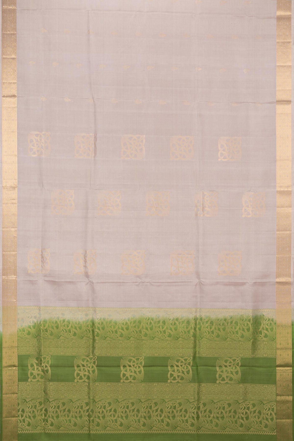 Flat view of Pure Silk Beige Soft Saree with Zari Butta on the body and Zari Border. 
