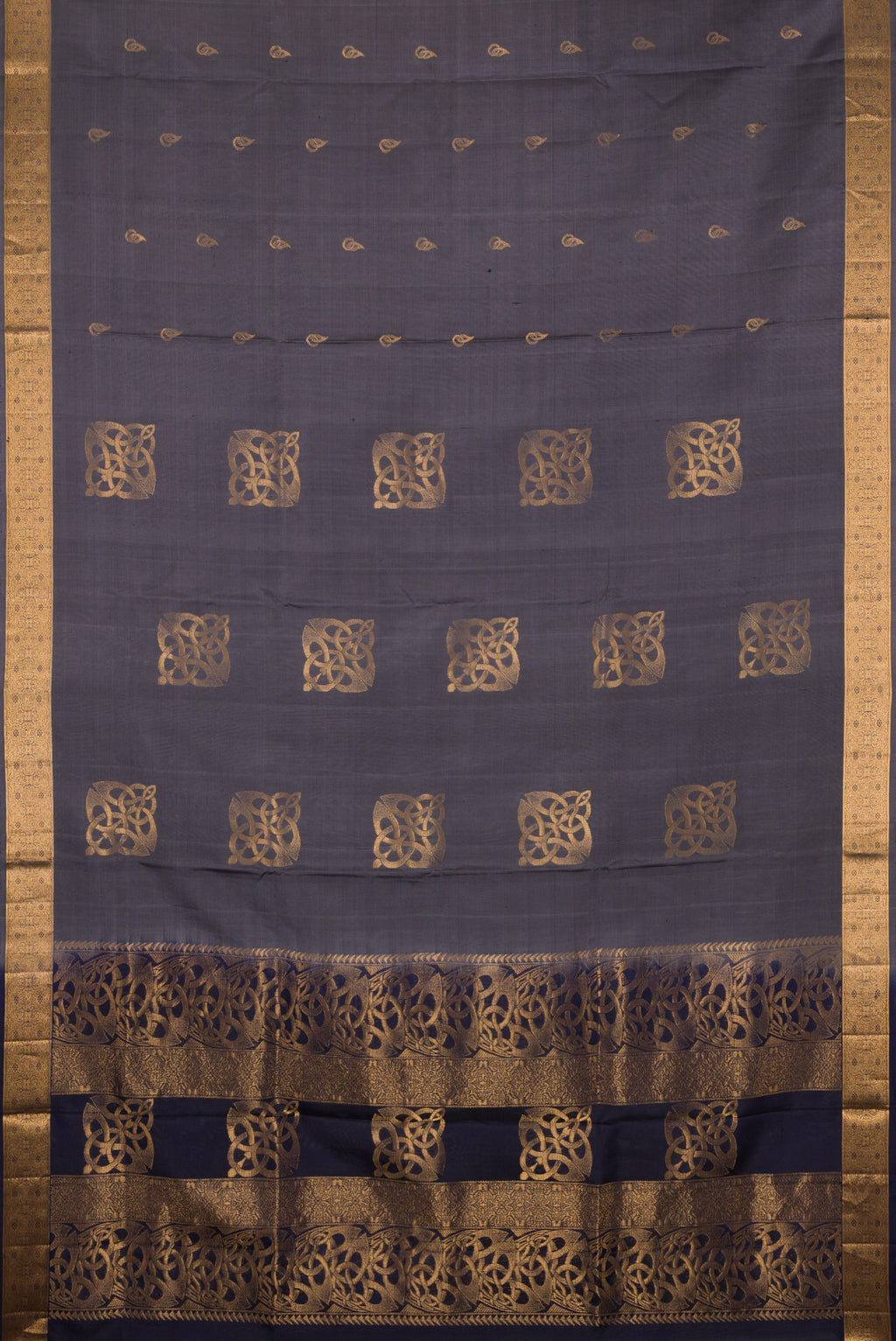 Flat view of Pure Silk Grey Soft Saree with Zari Butta on the body and Zari Border. 