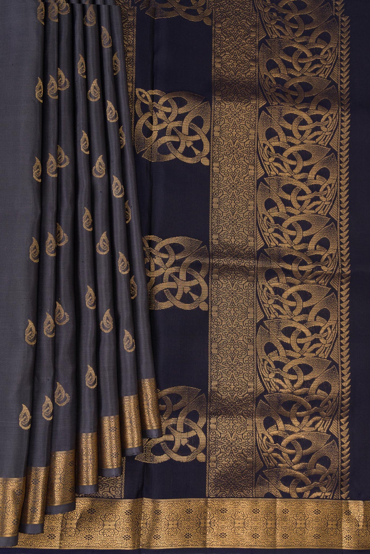 Pleats and pallu of Pure Silk Grey Soft Saree with Zari Butta on the body and Zari Border. 