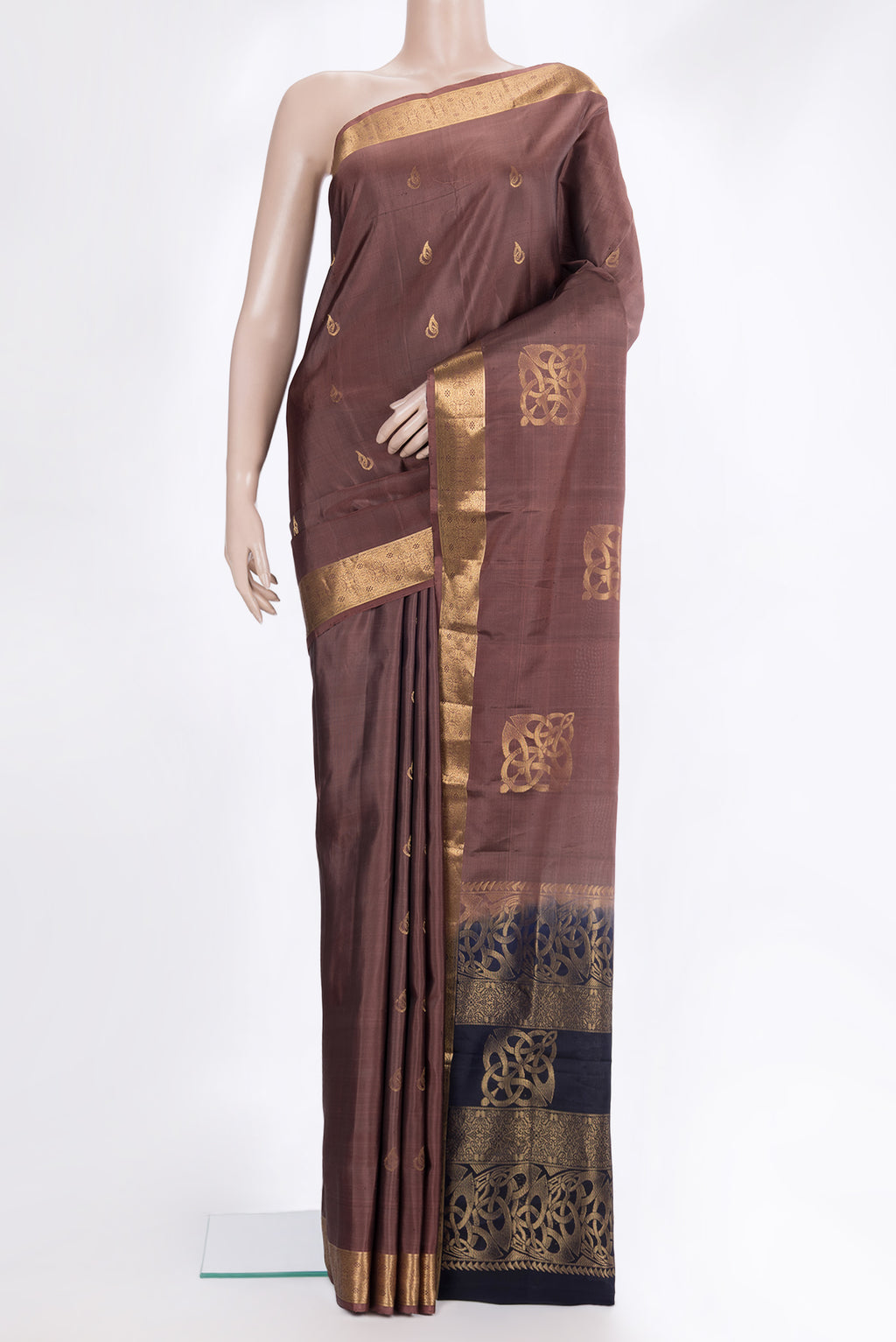 Pure Silk Brown Soft Saree with Zari Butta on the body and Zari Border.  displayed on a mannequin