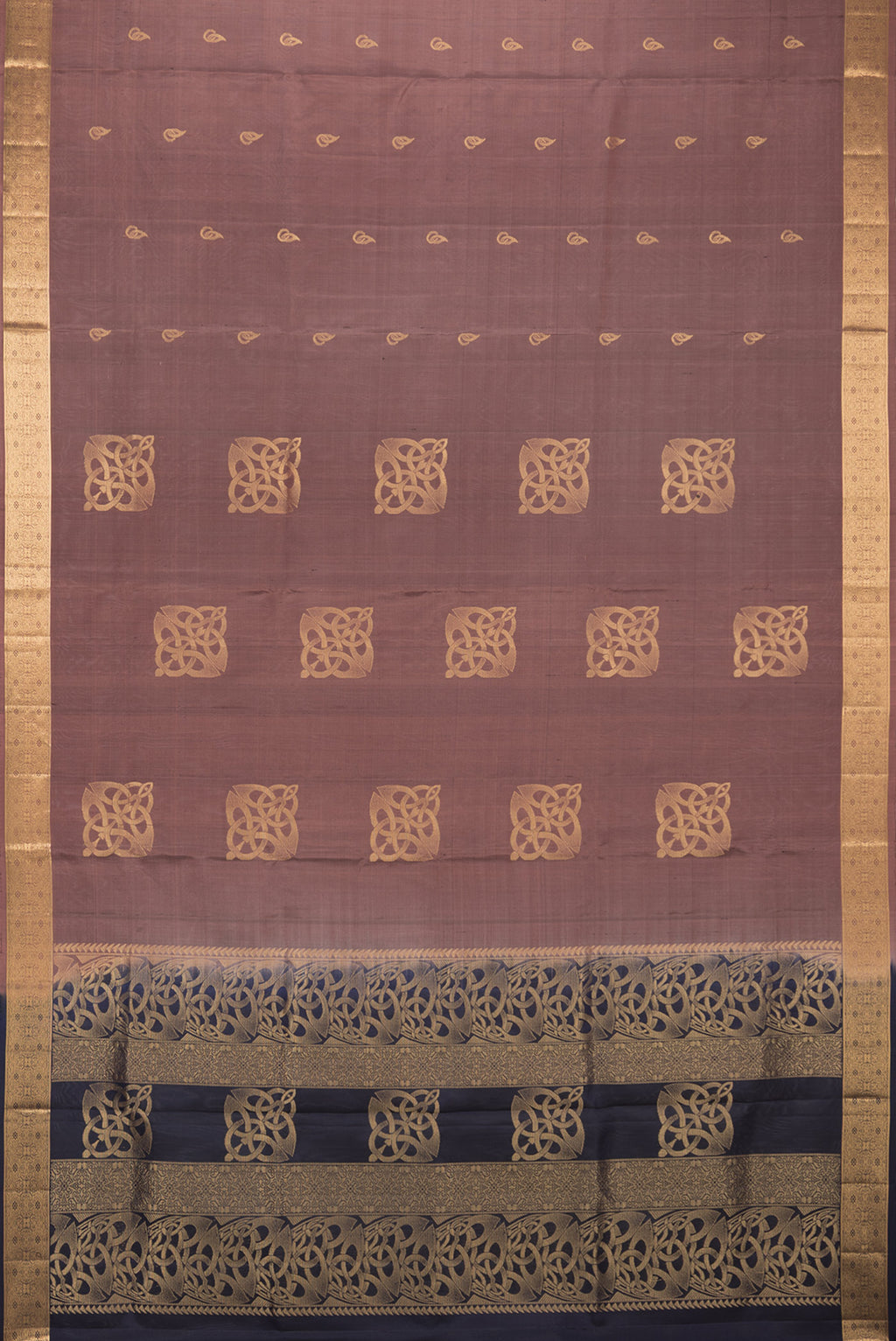 Flat view of Pure Silk Brown Soft Saree with Zari Butta on the body and Zari Border. 