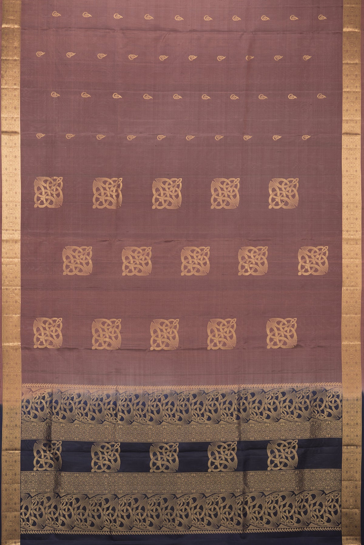 Flat view of Pure Silk Brown Soft Saree with Zari Butta on the body and Zari Border. 