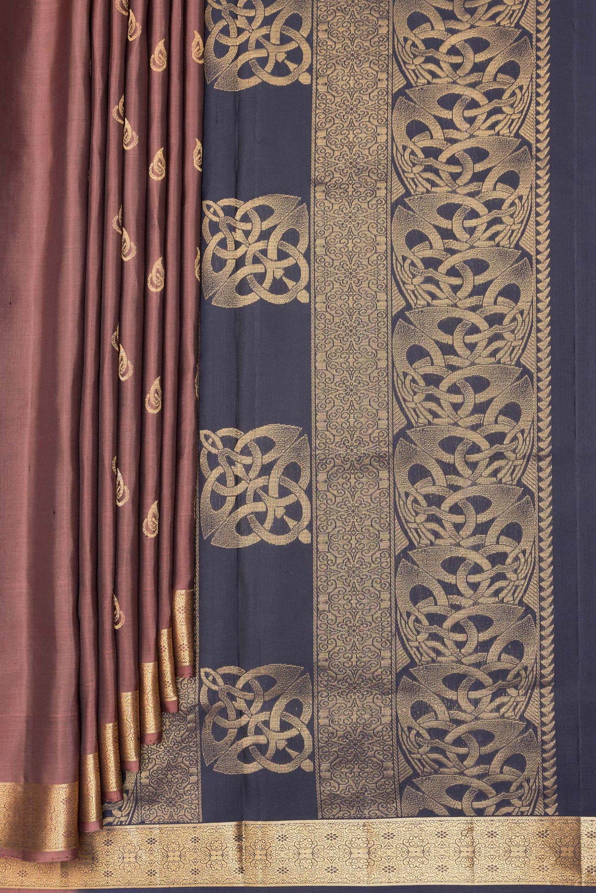 Pleats and pallu of Pure Silk Brown Soft Saree with Zari Butta on the body and Zari Border. 