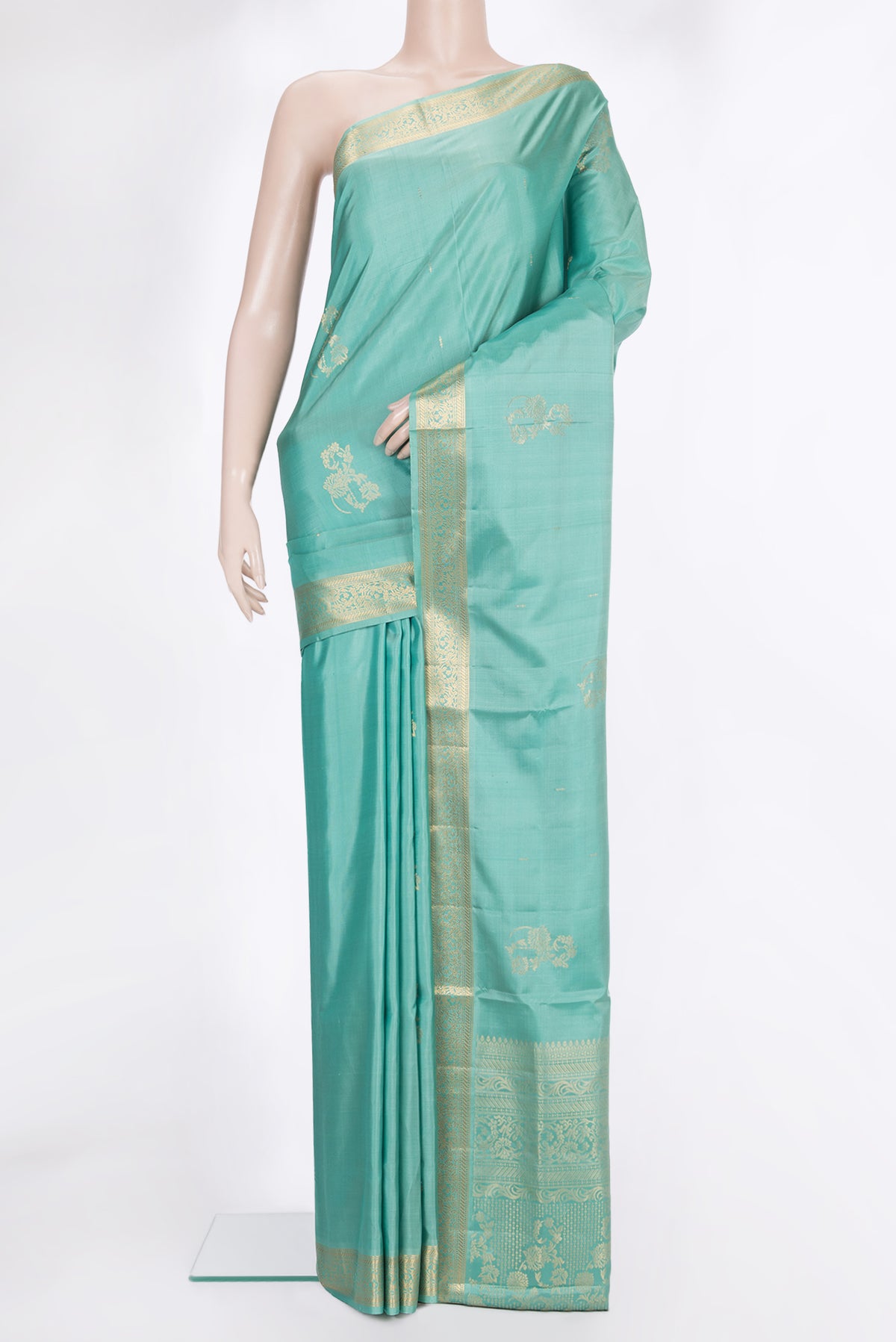 Pure Silk Light Green Soft Saree with Zari Butta on the body and Zari Border.  displayed on a mannequin