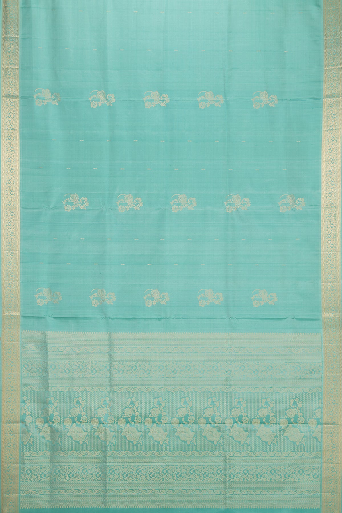 Flat view of Pure Silk Light Green Soft Saree with Zari Butta on the body and Zari Border. 
