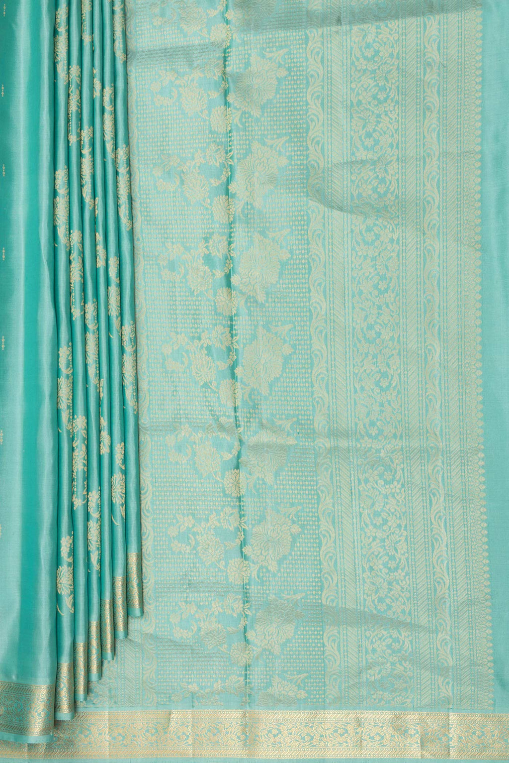 Pleats and pallu of Pure Silk Light Green Soft Saree with Zari Butta on the body and Zari Border. 