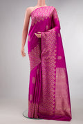 Pure Silk Pink Kanjivaram Saree with Zari Butta on the body and Fancy Border.  displayed on a mannequin